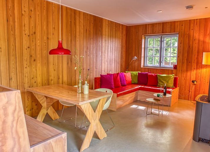 Attractive bedroom in cottage in Beuningen, Twente with wooden interior and modern bathroom.