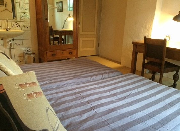 Gezellige woonkamer in VakantiehuisVasse.nl in Vasse, Twente met comfortabele zithoek en landelijke charme, ideaal voor ontspanning.