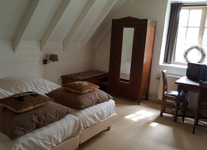 Gemuetlicher Innenbereich des Holiday homeVasse.nl in Vasse, Twente, mit rustikaler Einrichtung und stimmungsvoller Dekoration.