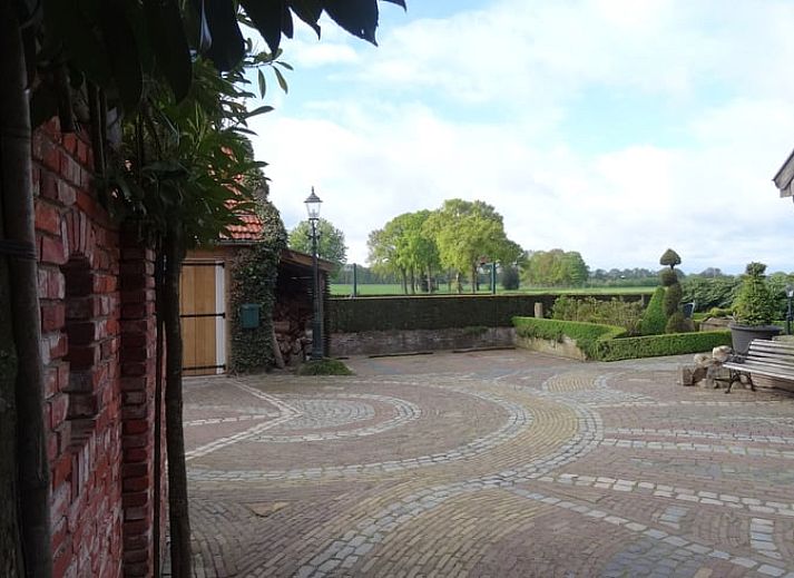 Charmante buitenkant van Huisje in Vasse, een vakantiehuis in Twente, Overijssel.