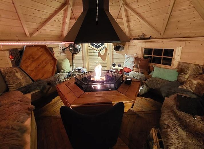 Cozy indoor area of Holiday Home in Overdinkel, Twente, with comfortable sitting area and bed.