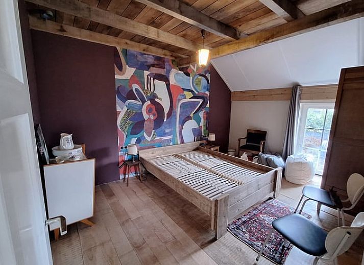 Charmantes Ferienhaus in Tilligte, Twente, mit laendlichem Flair und stimmungsvoll beleuchteter Terrasse. Ideal fuer einen entspannten Aufenthalt in Overijssel.