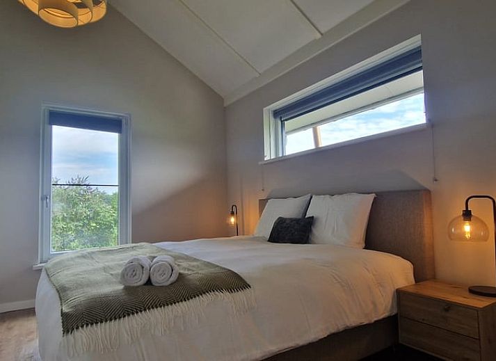 Enjoying wine and snacks on the veranda of Holiday home in Ambt Delden, Twente