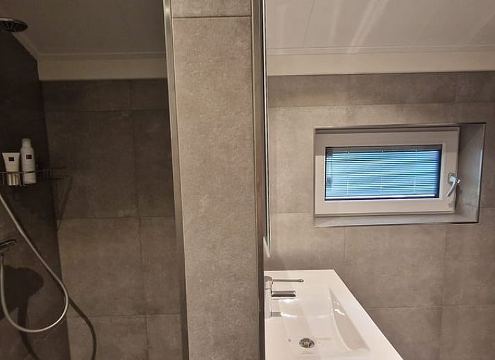 Enjoying wine and snacks on the veranda of Holiday home in Ambt Delden, Twente