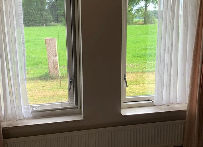 Cottage in Rossum, vacation home in Twente, rural charm with grazing cows near Overijssel.