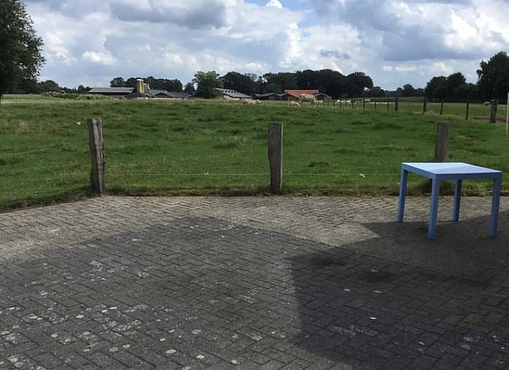 Cottage in Rossum, vacation home in Twente, attractive exterior with bricks and greenery in Overijssel.