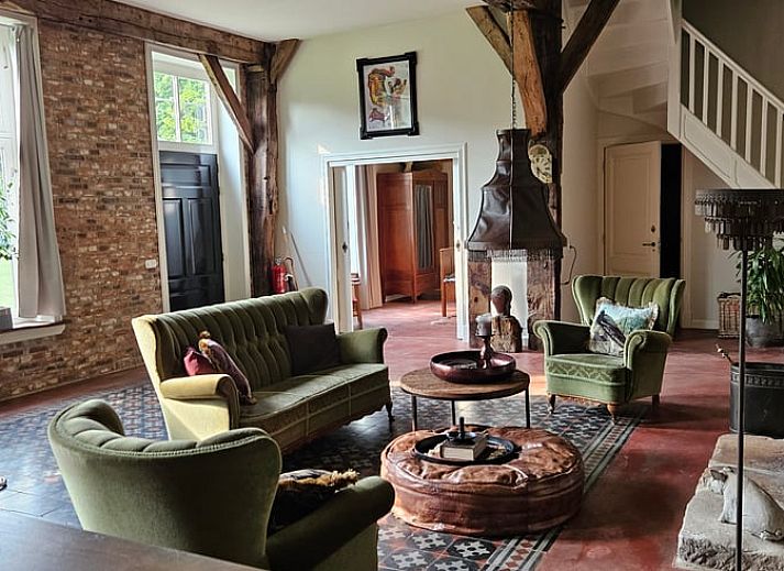 Cottage in Haaksbergen, a vacation home in Twente, Overijssel, surrounded by wild flowers and green nature for a relaxing stay.