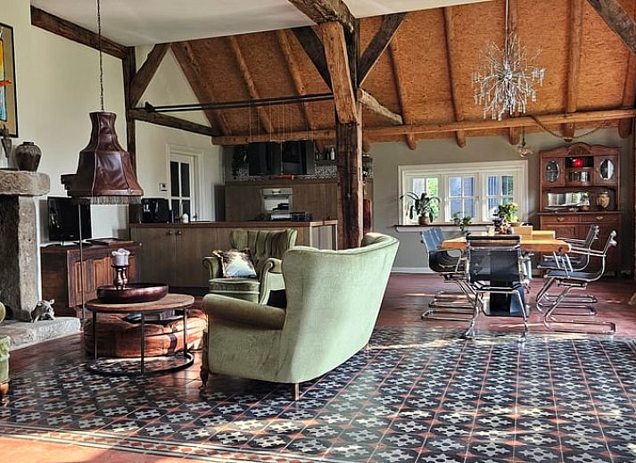 Cottage in Haaksbergen, a vacation home in Twente, Overijssel, surrounded by wild flowers and green nature for a relaxing stay.