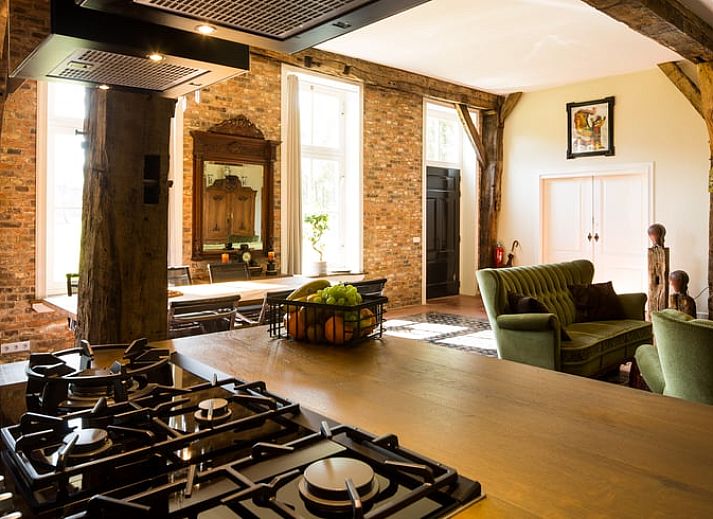 Cottage in Haaksbergen, a vacation home in Twente, Overijssel, surrounded by wild flowers and green nature for a relaxing stay.