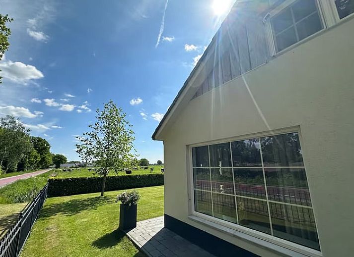 Bright interior with large windows in the cottage in Enschede, Twente.
