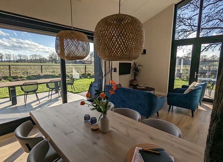 Cozy dining area in Holiday Home in Markelo, Twente with views of nature.