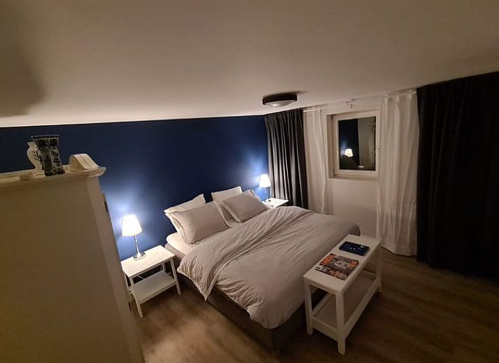 Vakantiehuisje in Markelo, een charmante vakantiewoning in Twente, Overijssel, omgeven door groene natuur en een uitnodigend terras.