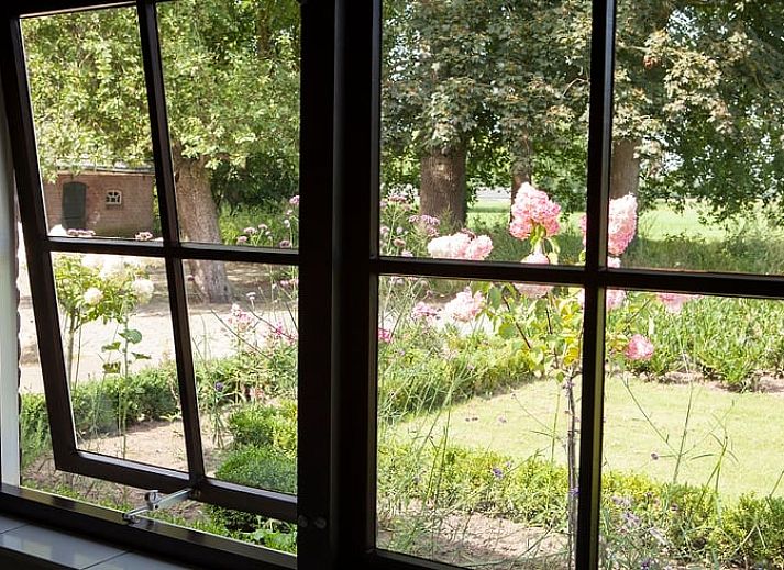 Cozy indoor area of Holiday Home in Markelo, Twente with modern kitchen and dining area, ideal for a relaxing stay in Overijssel.