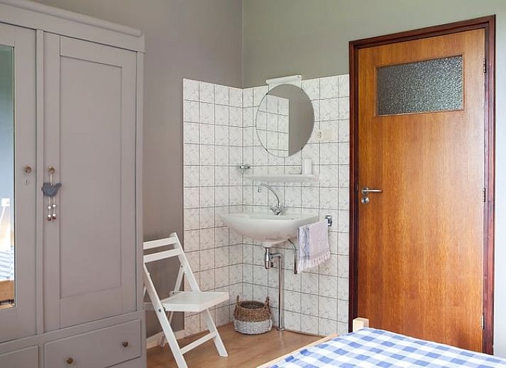 Cozy indoor area of Holiday Home in Markelo, Twente with modern kitchen and dining area, ideal for a relaxing stay in Overijssel.