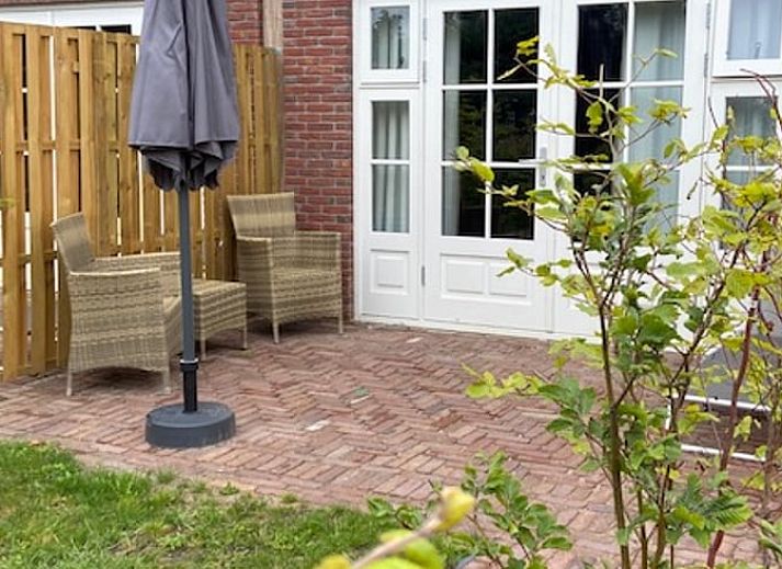 Veranda van Vakantiehuisje in Markelo met comfortabele stoelen in Twente, Overijssel.