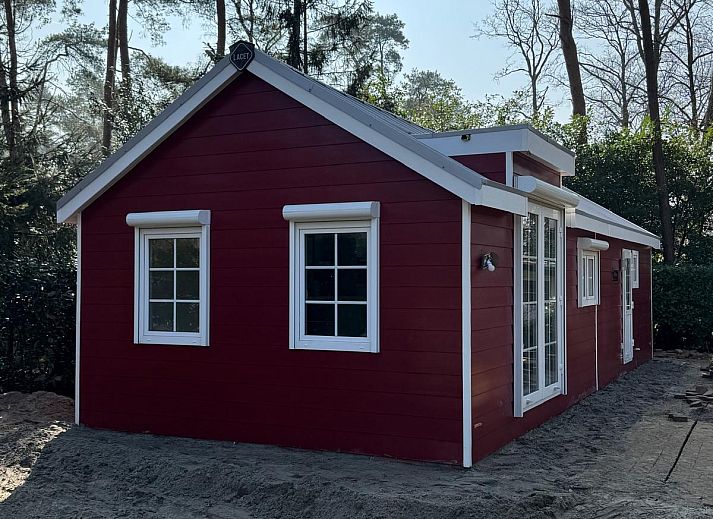 Charming red bungalow for sale in Markelo, Twente, located amidst the serene nature of Overijssel.