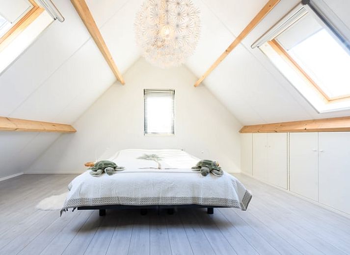 Terras van Huisje in Enter, vakantiehuis in Twente met uitzicht op groene omgeving in Overijssel.