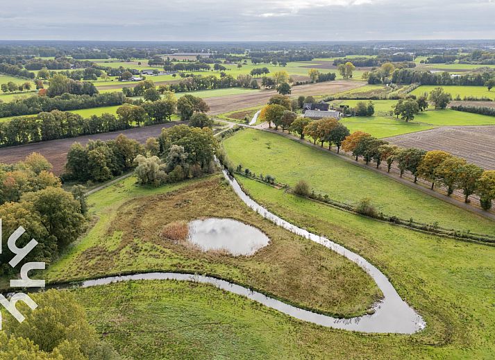 Stylish dining room in vacation home OV659, Enter, Twente with views of nature.