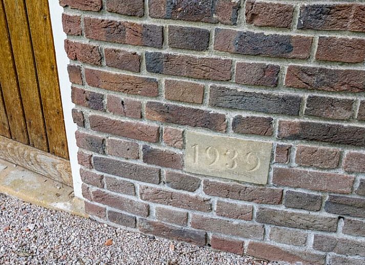 Cozy corner in Holiday Home in Denekamp, Twente, with decorative fox cushions, perfect for a relaxing stay.