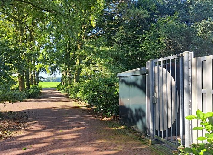 Bedroom in Cottage in Denekamp, vacation home in Twente, Overijssel, with colorful art on the wall.