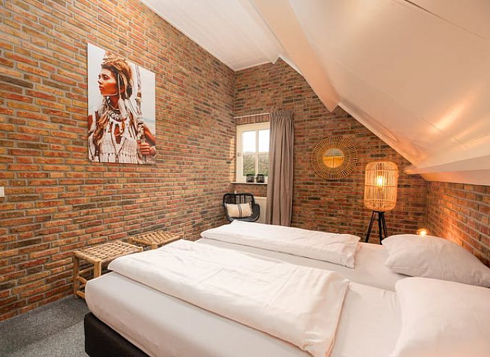 Cozy living room of Holiday home in Losser, Twente. Comfortable sitting area with natural light and stylish decor.