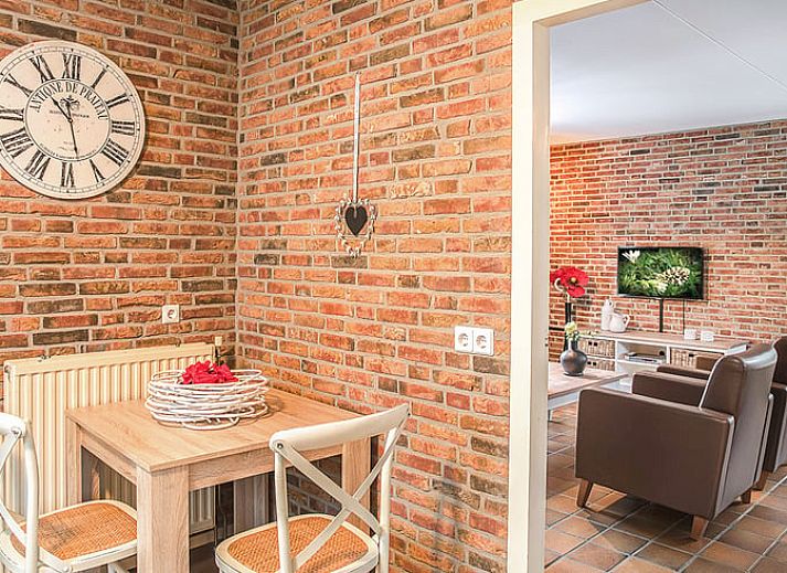 Cozy living room of Holiday home in Losser, Twente. Comfortable sitting area with natural light and stylish decor.