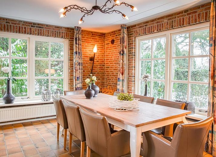 Cozy living room of Holiday home in Losser, Twente. Comfortable sitting area with natural light and stylish decor.