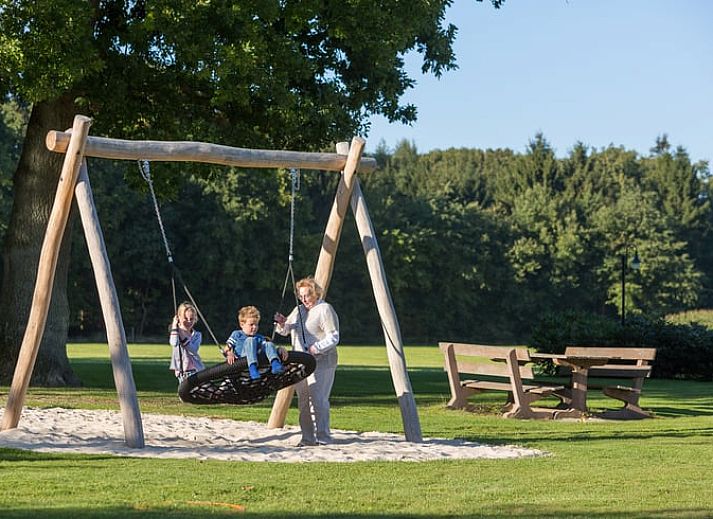 Cozy indoor area of Holiday Home in Losser, Twente, with a beautiful view of the green surroundings from the living room.