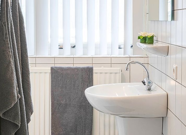 Cozy indoor area of Holiday Home in Losser, Twente, with a beautiful view of the green surroundings from the living room.
