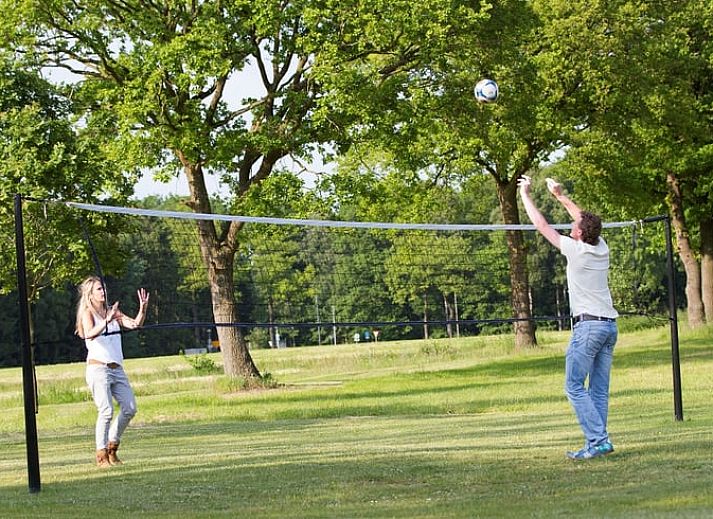 Cozy living room in Holiday Home in Losser, Twente, Overijssel with comfortable sofas and garden view.