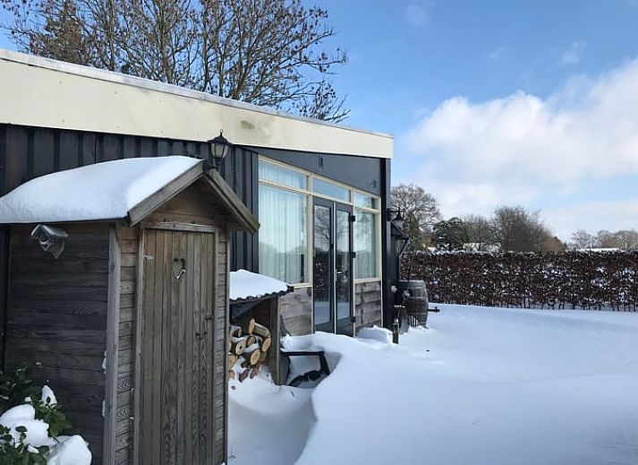 Ferienhaus in Losser, gemuetliche Sitzecke mit Ofen im Ferienhaus Overijssel.