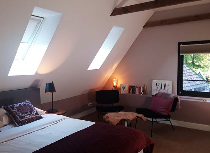 Attractive bedroom in Cottage in Losser, vacation home in Twente, Overijssel. Comfort and coziness in the interior.