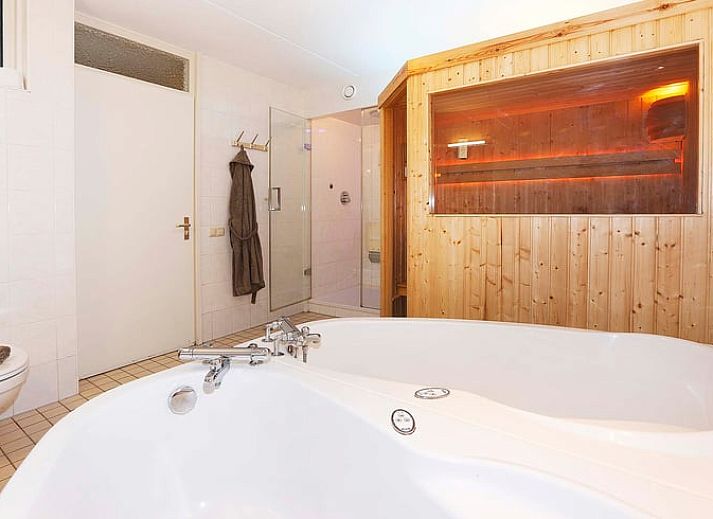 Spacious living room in Cottage in Deurningen, vacation home in Twente, Overijssel with comfortable seating area.