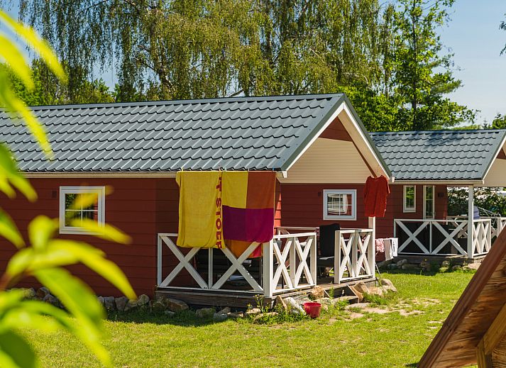 Winter charm at Scandinavian lodge in Zuna, vacation home with snowy terrace in Twente, Overijssel.