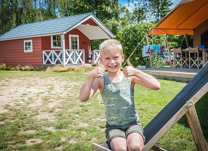 Winter charm at Scandinavian lodge in Zuna, vacation home with snowy terrace in Twente, Overijssel.