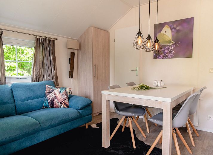 Winter charm at Scandinavian lodge in Zuna, vacation home with snowy terrace in Twente, Overijssel.