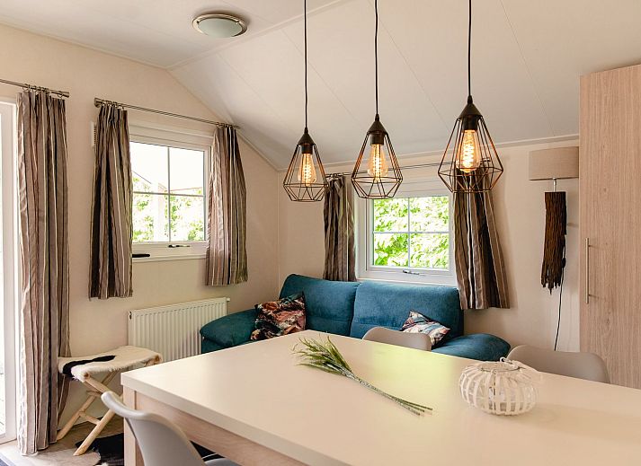 Winter charm at Scandinavian lodge in Zuna, vacation home with snowy terrace in Twente, Overijssel.