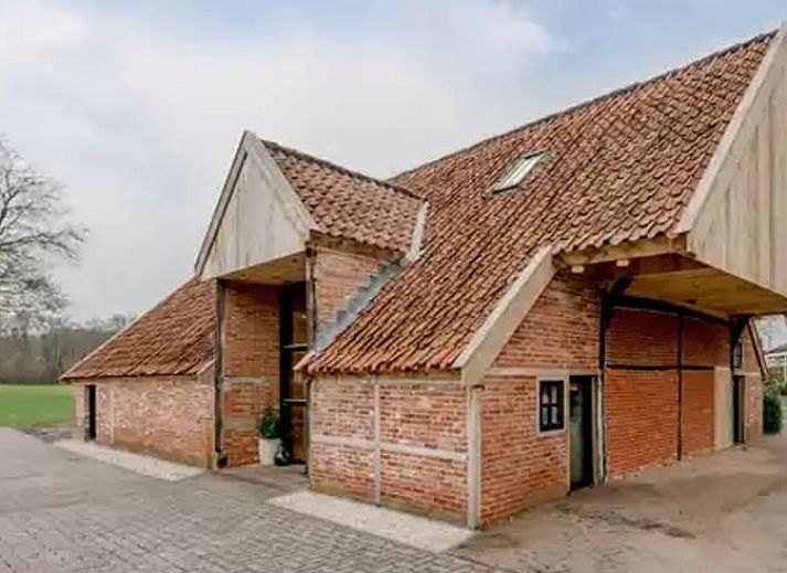 Cottage in Agelo, a charming vacation home in Twente, Overijssel, surrounded by nature and rustic architecture.