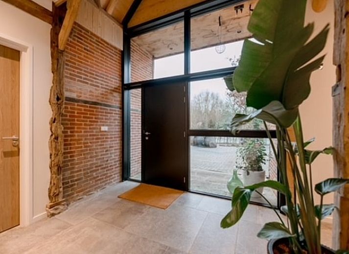 Cottage in Agelo, a charming vacation home in Twente, Overijssel, surrounded by nature and rustic architecture.