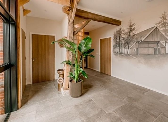 Cottage in Agelo, a charming vacation home in Twente, Overijssel, surrounded by nature and rustic architecture.