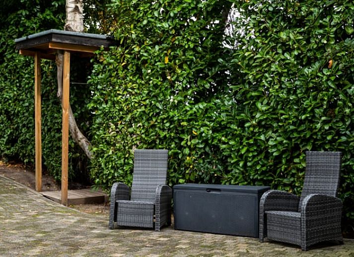 Uitzicht vanuit vakantiehuis in Vroomshoop, Twente, op groene velden.