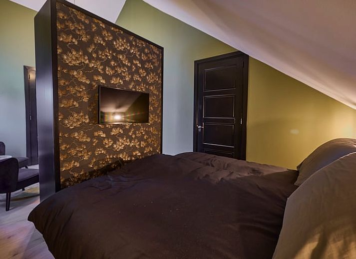 Cozy sitting area with fireplace in Holiday home in Glane, Twente, Overijssel.