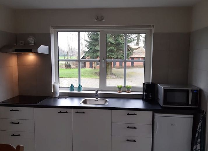 Cozy terrace at Holiday home in Lattrop Breklenkamp, ideal for outdoor dining in Twente, Overijssel.