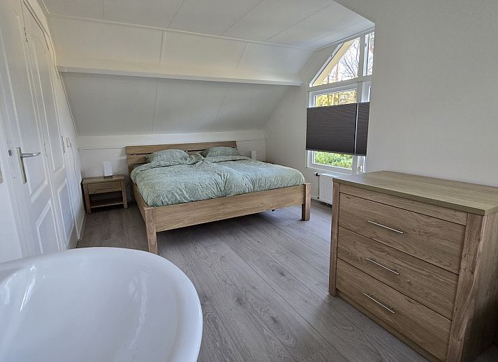 Geniessen Sie die Ruhe auf der Terrasse des Ferienhauses OV755 in Holten, Salland, Overijssel, umgeben von gruener Natur und frischer Luft.