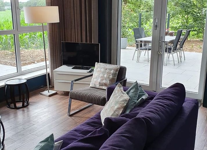 Geniet van de rust in het Huisje in Holten, een sfeervol vakantiehuis in Salland, Overijssel met een ruim terras omgeven door natuur.