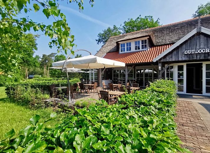 Cozy bathroom in Cottage in Holten, a vacation home in Holten, Salland, Overijssel with wooden interior and freestanding bathtub.
