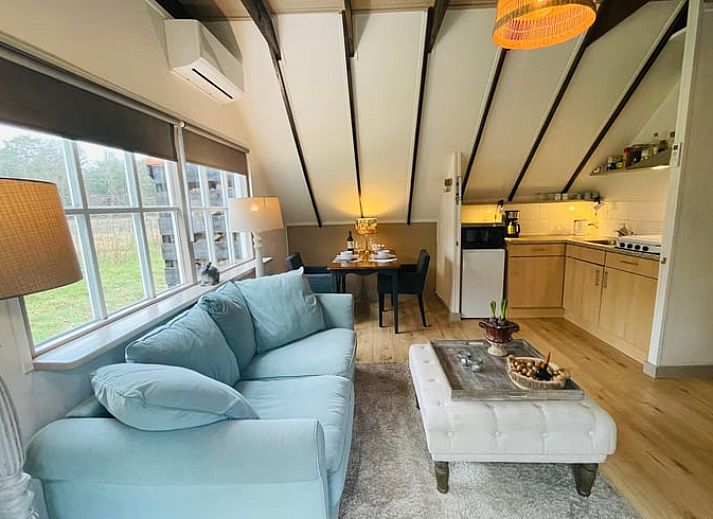 Buitenzijde van Vakantiehuisje in Wijhe, Salland met terras en groene omgeving in Overijssel.