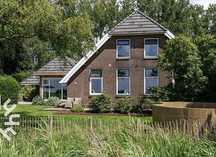 OV530 vacation home in Zwolle, Overijssel with green garden and traditional architecture.