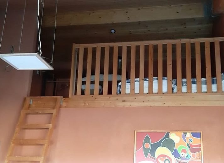 Wood stove in the living room of Cottage in Raalte, vacation home in Salland.