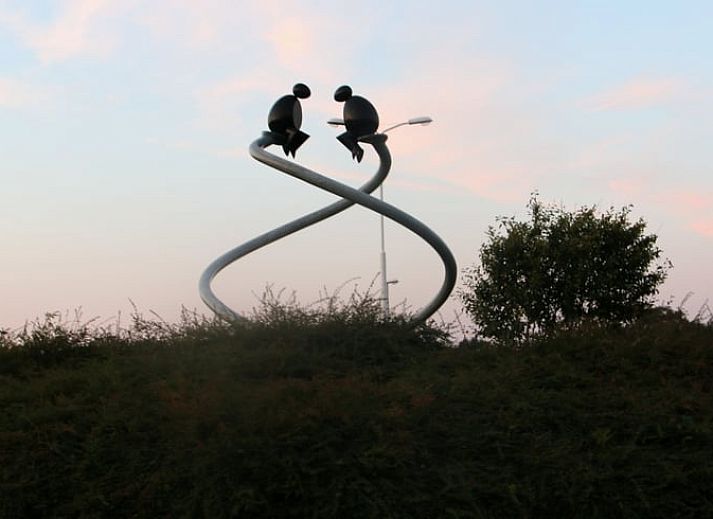 Charming cottage in Heeten, Salland with an inviting brick facade and green garden.